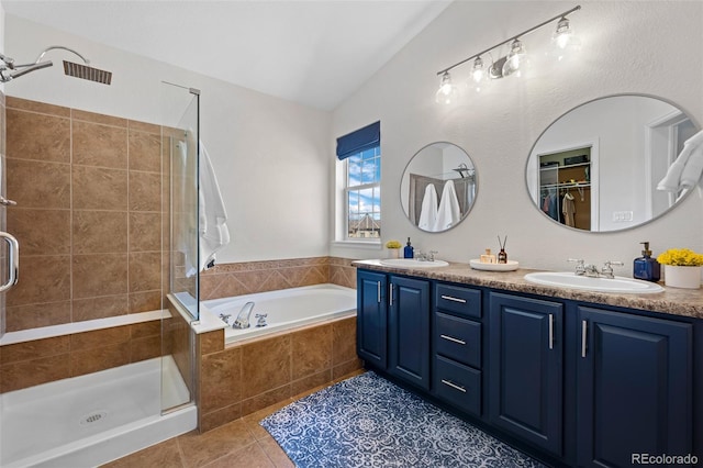 2880 Breezy Ln, Castle Rock, CO 80109 - full bath featuring a stall shower, tile patterned floors, double vanity, and vaulted ceiling