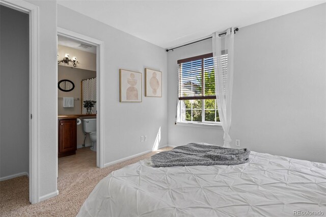 2880 Breezy Ln, Castle Rock, CO 80109 - bedroom featuring light carpet, baseboards, and ensuite bathroom