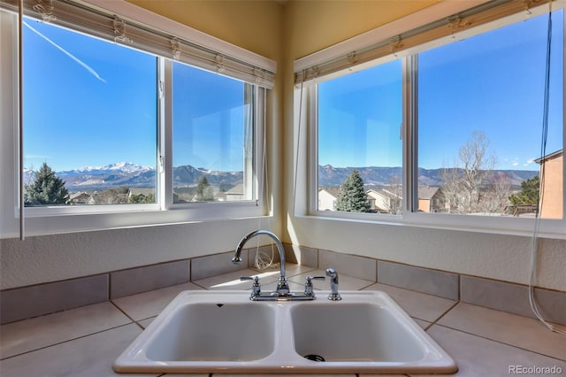 kitchen with a sink and a mountain view