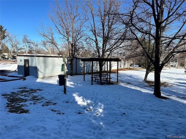 view of yard covered in snow