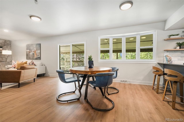 1420 W Ridge Rd, Littleton, CO 80120 - dining room featuring light wood finished floors and baseboards