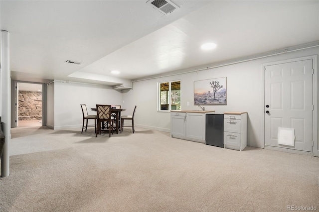 1420 W Ridge Rd, Littleton, CO 80120 - kitchen with light carpet, refrigerator, baseboards, and recessed lighting