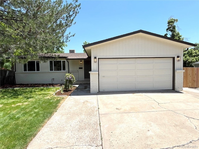 6484 S Datura St, Littleton, CO 80120 - single story home featuring brick siding, concrete driveway, and a garage