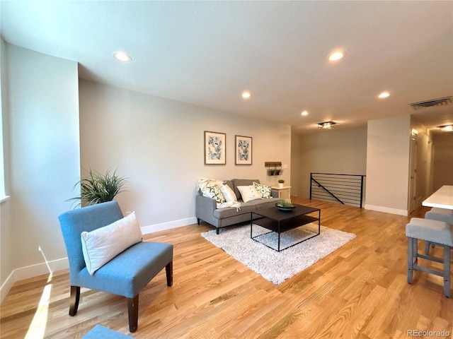 6484 S Datura St, Littleton, CO 80120 - living area featuring light wood finished floors and recessed lighting