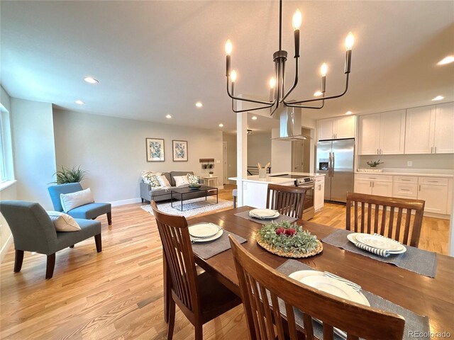 6484 S Datura St, Littleton, CO 80120 - dining space featuring light wood-style flooring, a chandelier, and recessed lighting