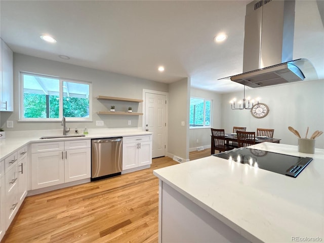 6484 S Datura St, Littleton, CO 80120 - kitchen with dishwasher, island exhaust hood, light wood-style floors, white cabinetry, and a chandelier