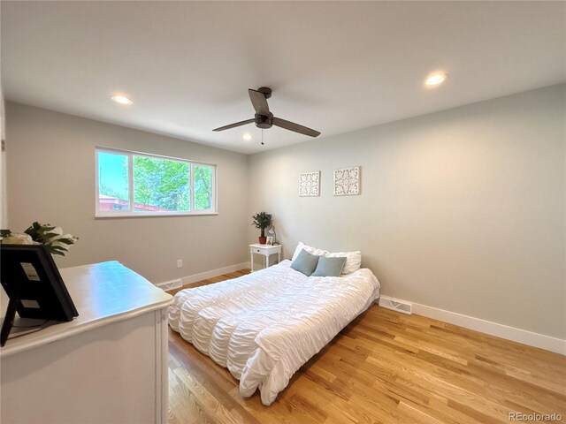 6484 S Datura St, Littleton, CO 80120 - bedroom featuring light wood-type flooring, recessed lighting, and a ceiling fan