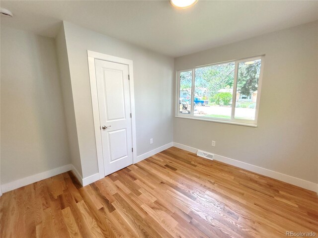 6484 S Datura St, Littleton, CO 80120 - unfurnished bedroom with light wood-style flooring