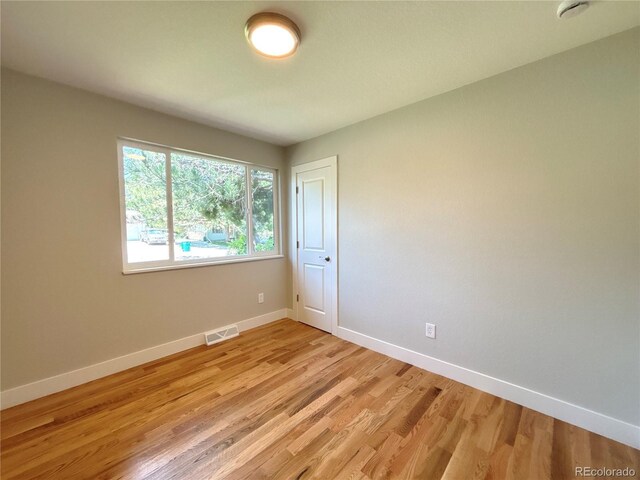 6484 S Datura St, Littleton, CO 80120 - unfurnished room with light wood-style flooring and a smoke detector