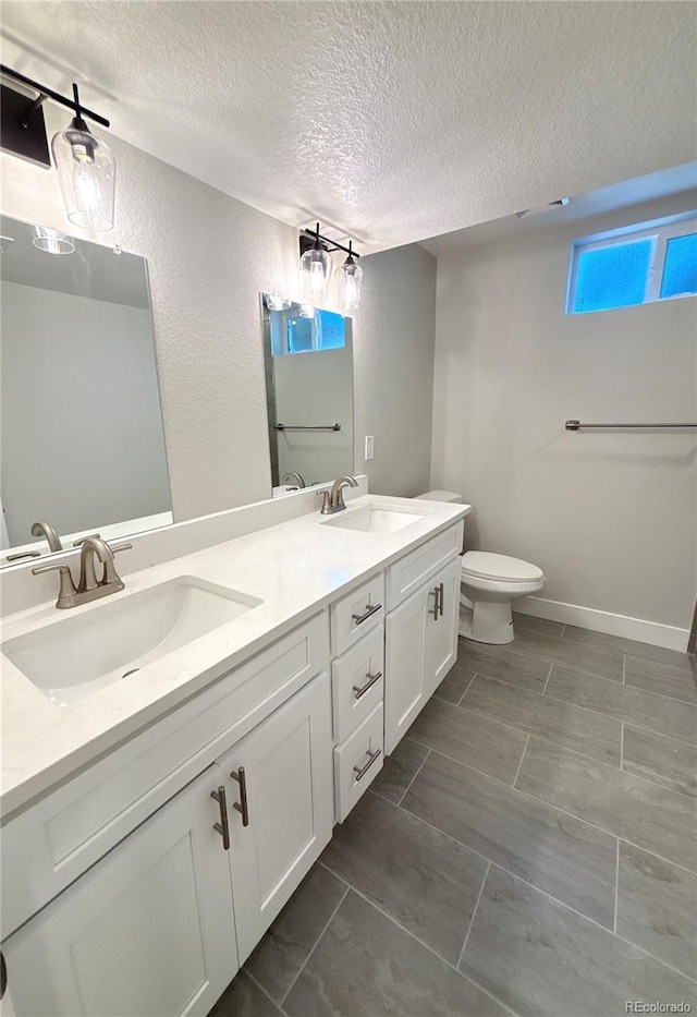 6484 S Datura St, Littleton, CO 80120 - full bathroom with a textured ceiling and double vanity