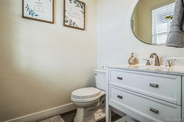 13644 Ulster St, Thornton, CO 80602 - bathroom featuring toilet, vanity, and baseboards