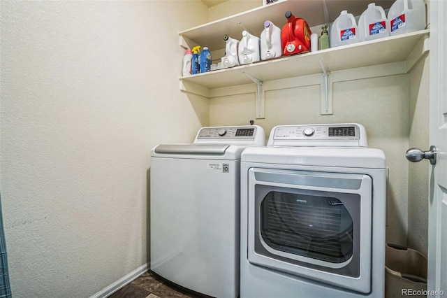 13644 Ulster St, Thornton, CO 80602 - washroom with washing machine and clothes dryer, baseboards, and a textured wall