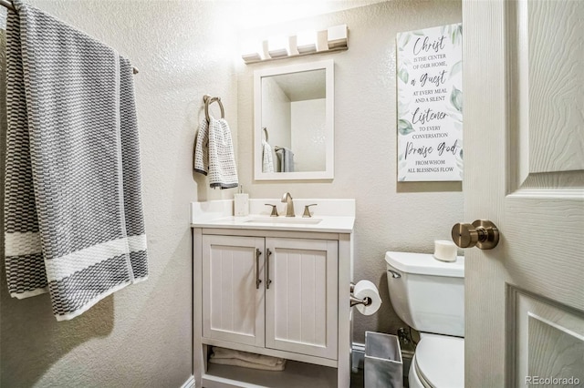 13644 Ulster St, Thornton, CO 80602 - bathroom with vanity, toilet, and a textured wall