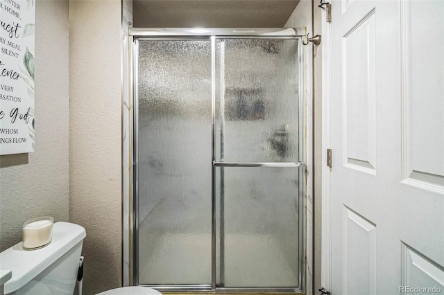 13644 Ulster St, Thornton, CO 80602 - bathroom with toilet and a shower stall