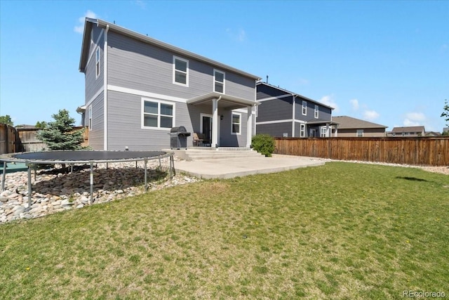 13644 Ulster St, Thornton, CO 80602 - back of property featuring a patio and a trampoline