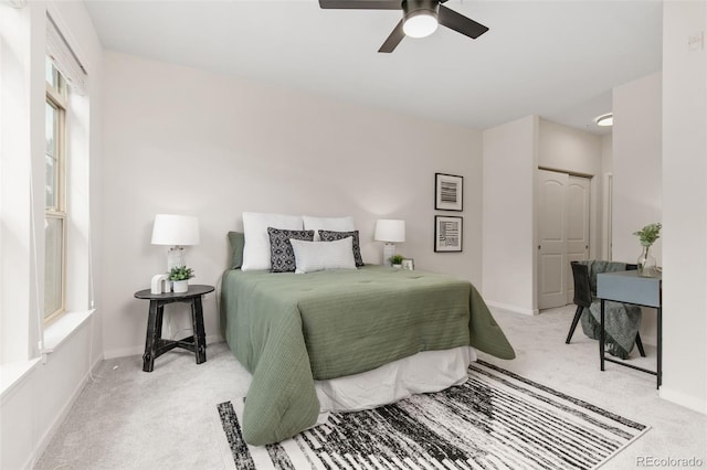 carpeted bedroom featuring ceiling fan