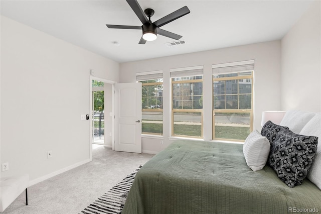 bedroom featuring light colored carpet and ceiling fan