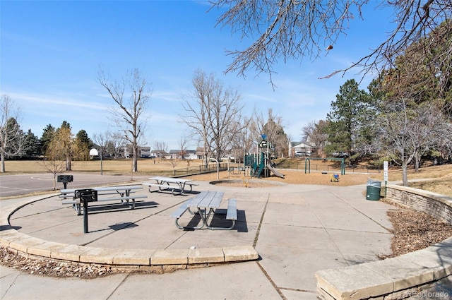 view of community with playground community and fence