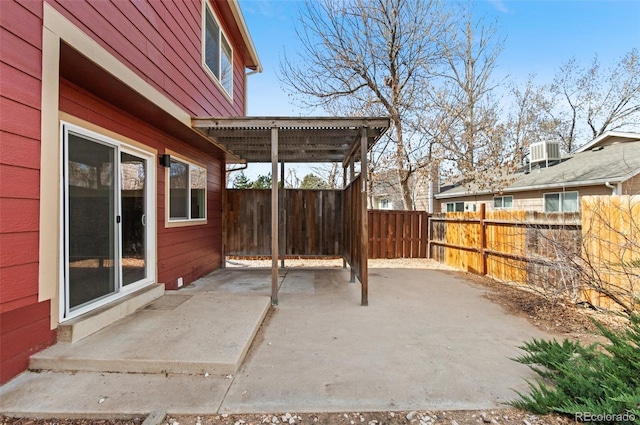 view of patio featuring central AC unit and a fenced backyard