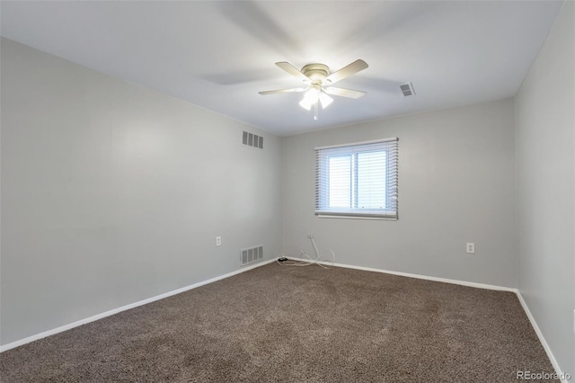 carpeted empty room with ceiling fan