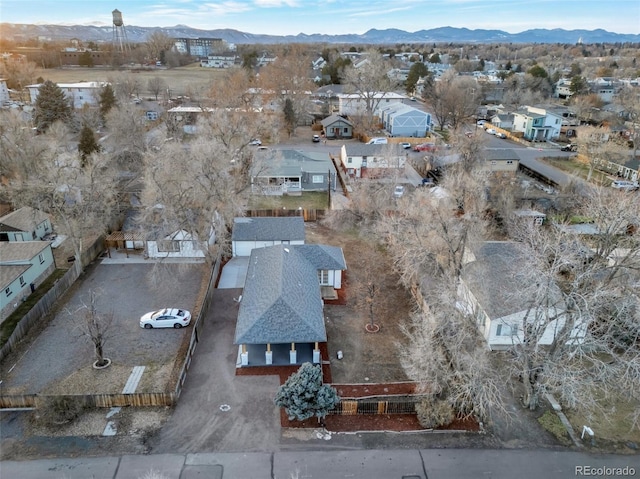 birds eye view of property with a mountain view