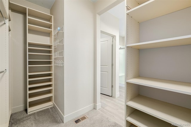 1848 W 68th Ave, Denver, CO 80221 - walk in closet featuring light colored carpet
