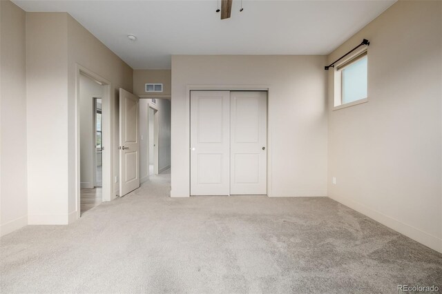 1848 W 68th Ave, Denver, CO 80221 - unfurnished bedroom with carpet flooring, a closet, and baseboards