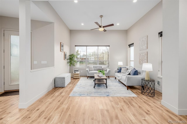 1848 W 68th Ave, Denver, CO 80221 - living room featuring ceiling fan, wood finished floors, baseboards, and recessed lighting