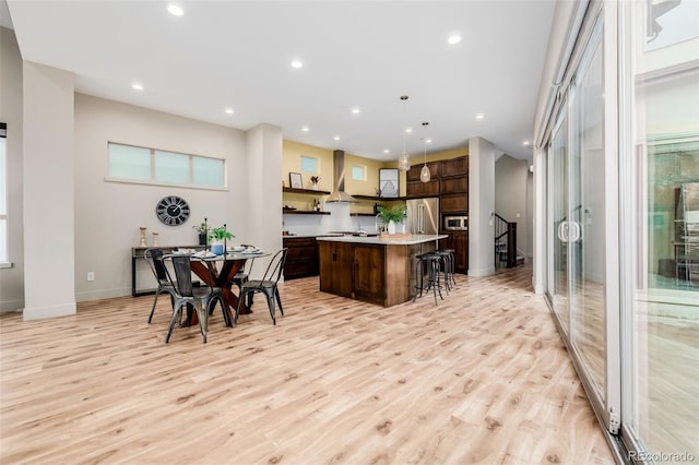 1848 W 68th Ave, Denver, CO 80221 - dining area featuring recessed lighting, light wood-style floors, and baseboards