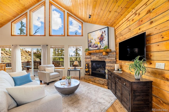 146 Atoka Dr, Como, CO 80432 - living room with wood ceiling, a fireplace, wood finished floors, and high vaulted ceiling