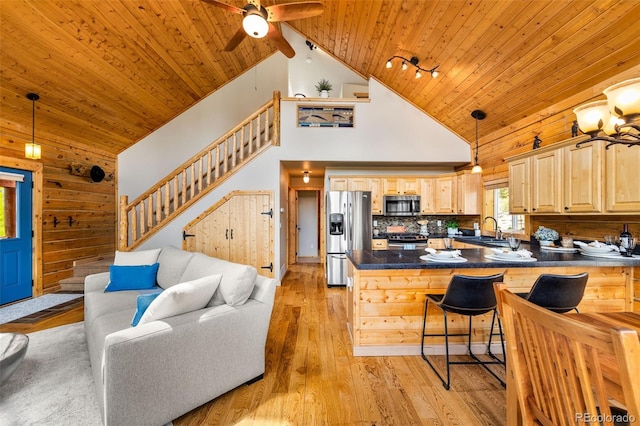 146 Atoka Dr, Como, CO 80432 - kitchen featuring stainless steel appliances, wood ceiling, high vaulted ceiling, dark countertops, and a peninsula