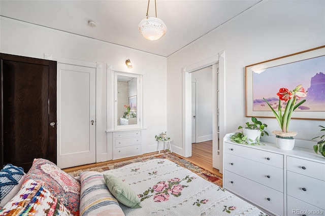 bedroom with light wood-type flooring