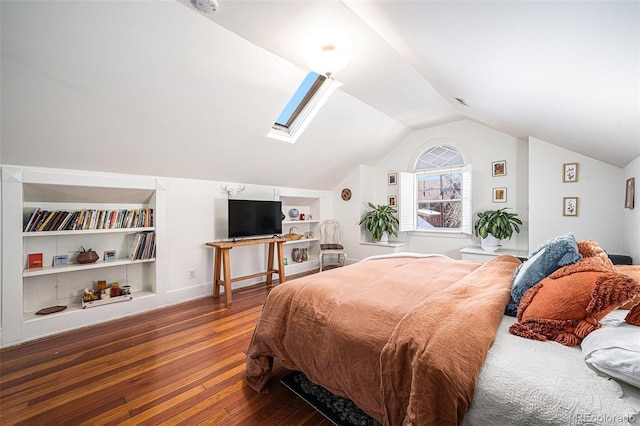 bedroom with wood-type flooring and vaulted ceiling with skylight