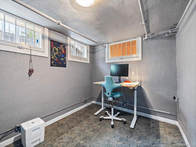 office featuring plenty of natural light and a textured ceiling