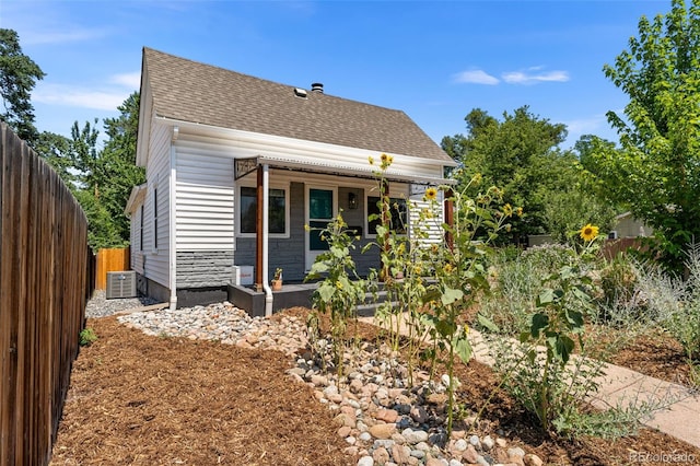 rear view of property featuring central air condition unit