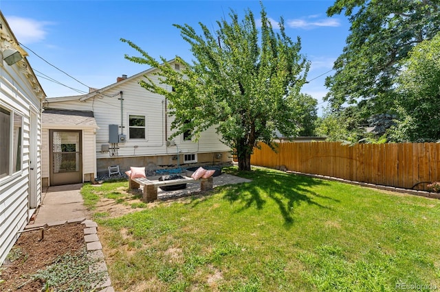 view of yard with a fire pit