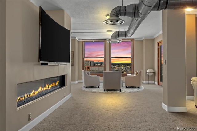 carpeted dining space featuring crown molding