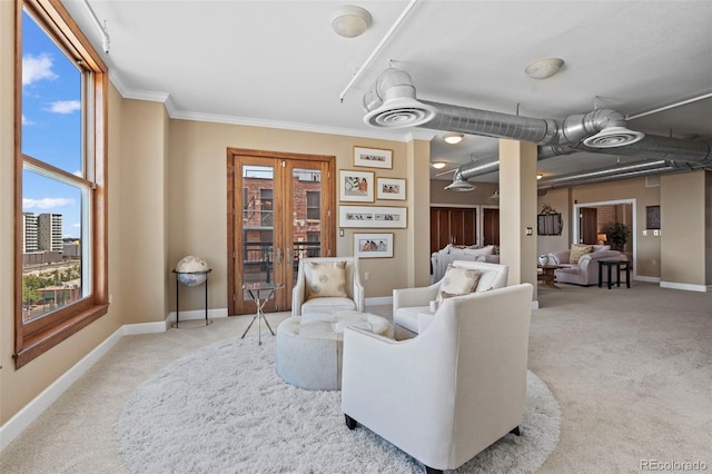 living room featuring carpet floors and ornamental molding