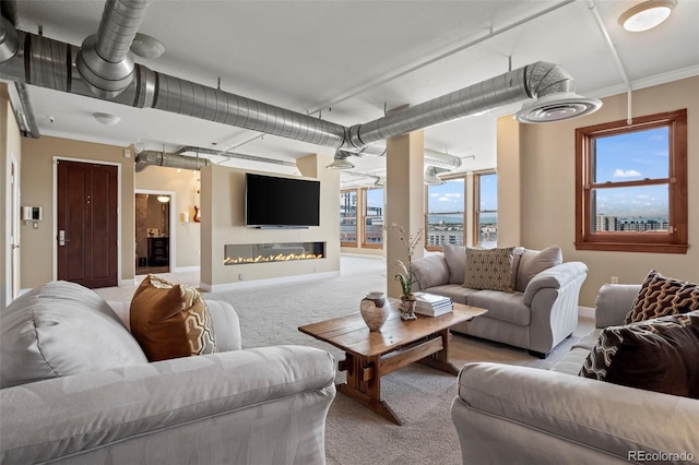 living room featuring light colored carpet and ornamental molding