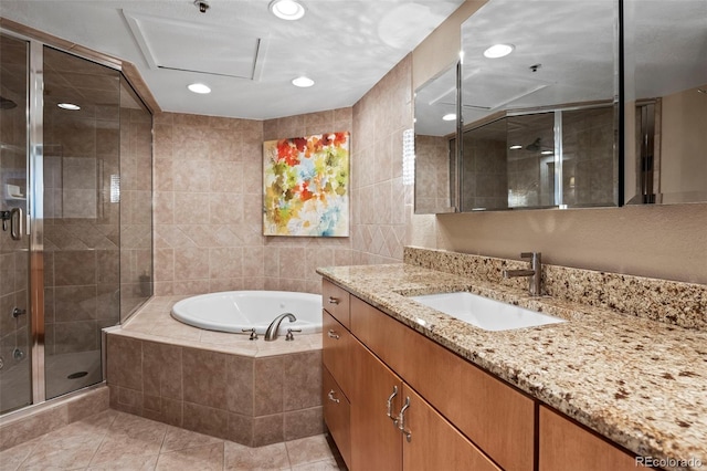 bathroom with tile patterned floors, vanity, and plus walk in shower