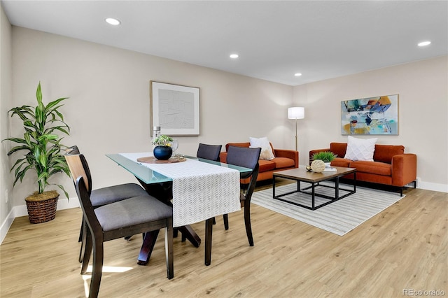 10431 Holland St, Broomfield, CO 80021 - dining space featuring light wood-style flooring, baseboards, and recessed lighting