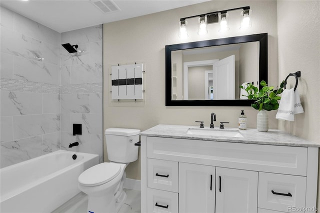 10431 Holland St, Broomfield, CO 80021 - bathroom featuring vanity, toilet, tub / shower combination, baseboards, and marble look tile flooring