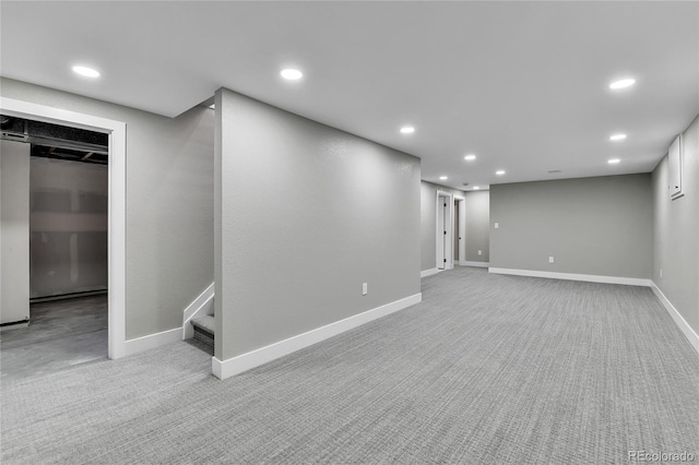 10431 Holland St, Broomfield, CO 80021 - finished below grade area with carpet flooring, recessed lighting, baseboards, and stairway