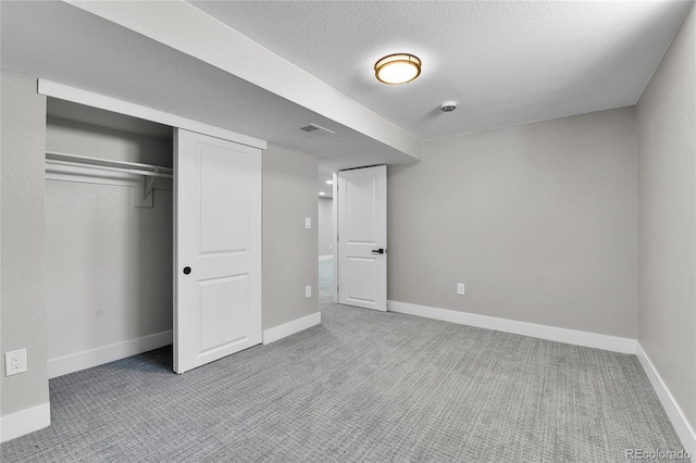 10431 Holland St, Broomfield, CO 80021 - unfurnished bedroom featuring carpet flooring, baseboards, a closet, and a textured ceiling