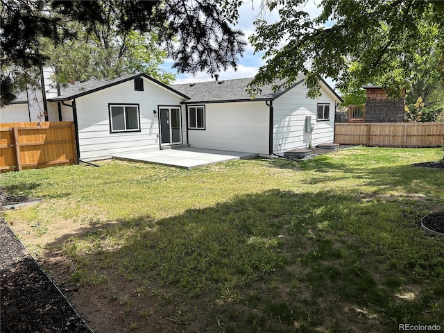 10431 Holland St, Broomfield, CO 80021 - rear view of house with a patio and a shingled roof