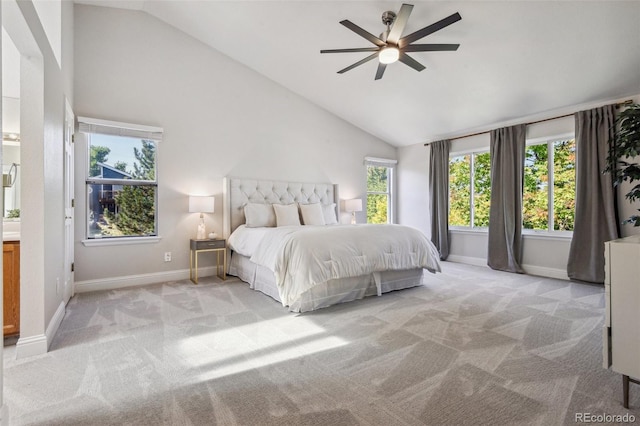 unfurnished bedroom with light colored carpet, high vaulted ceiling, and ceiling fan