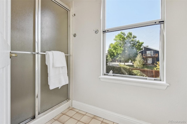 bathroom featuring tile patterned flooring and walk in shower