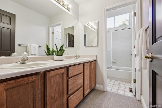 bathroom with tile patterned floors, vanity, and washtub / shower combination