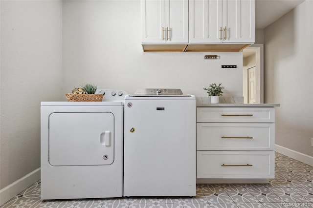 clothes washing area featuring tile patterned flooring and washing machine and dryer