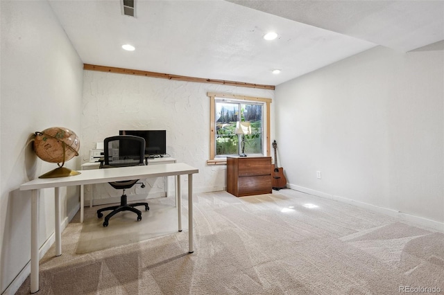 office area featuring light carpet